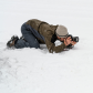Photographer takes photographs of a common raven